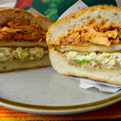 Poblano cemita with avocado, Oaxaca cheese, and red onion