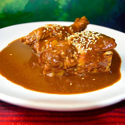 Chicken covered in traditional mole poblano sauce