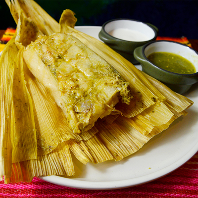 Traditional tamales wrapped in corn husks